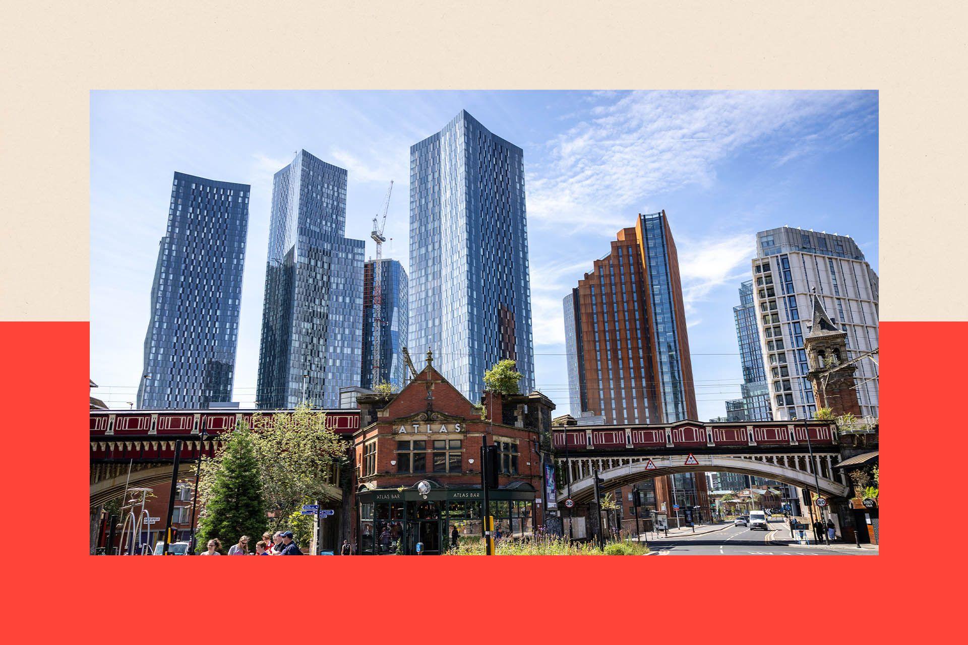 A  view of the skyline in Manchester City Centre. An Edwardian building and a bridge are in the foreground with skyscrapers in the background.