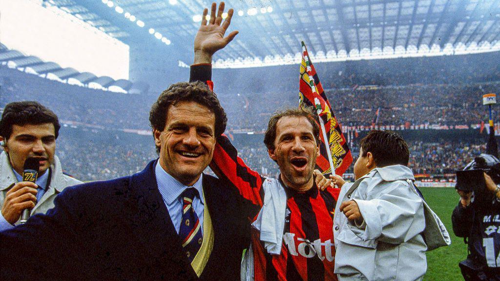 Fabio Capello and Franco Baresi celebrate AC Milan's 1993-94 Serie A title at the San Siro
