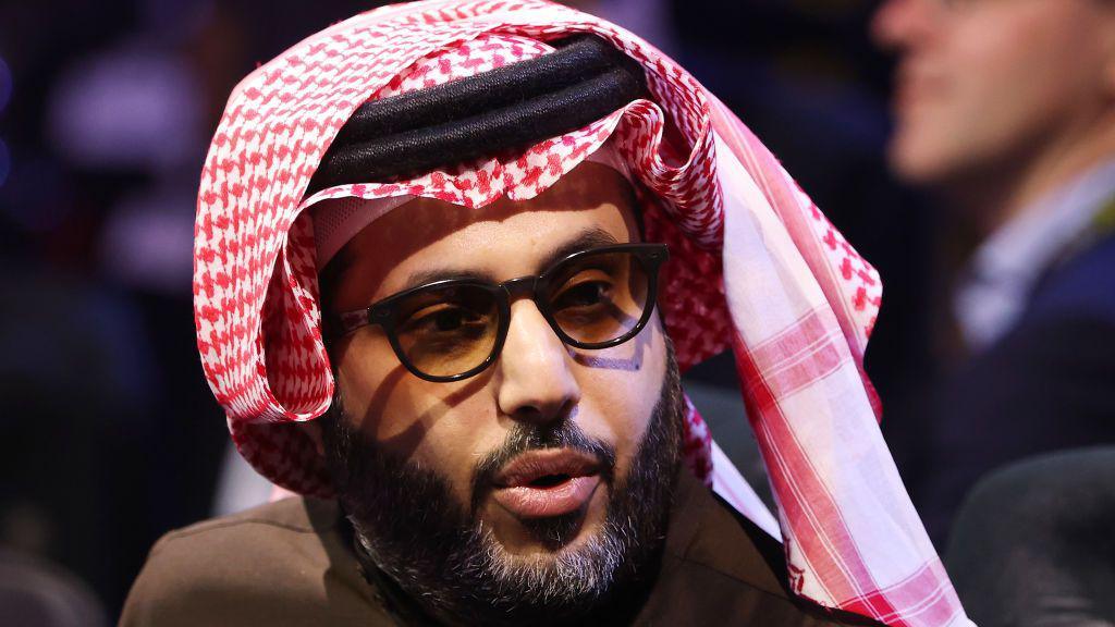 Turki Alalshikh looks on from ringside before a boxing fight in Riyadh, Saudi Arabia.