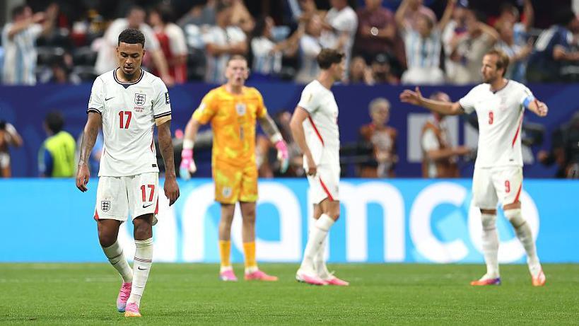 England's Morgan Rogers, Jordan Pickford, John Stones and Harry Kane look dejected after Argentina scored