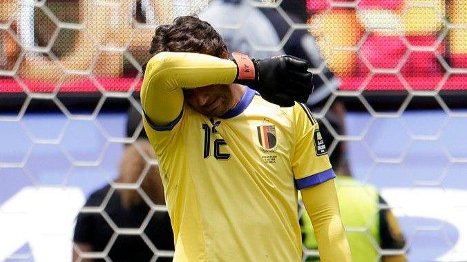 Senne Lammens with his arm over his head after his mistake in Belgium's World Cup defeat by Spain