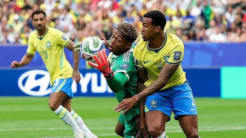 Zion Suzuki grabs for the ball in Japan's last-32 match against Brazil