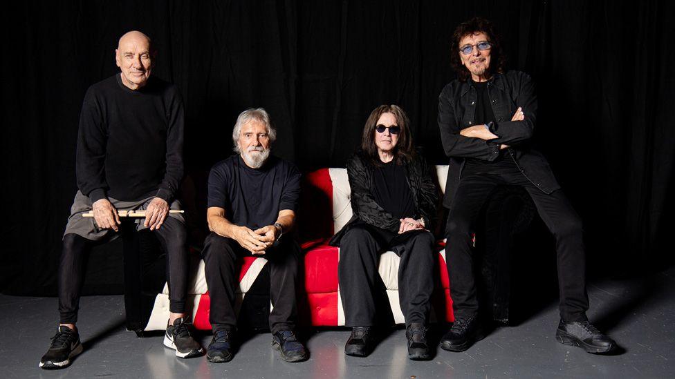 A recent photo of the four original Black Sabbath members posing together