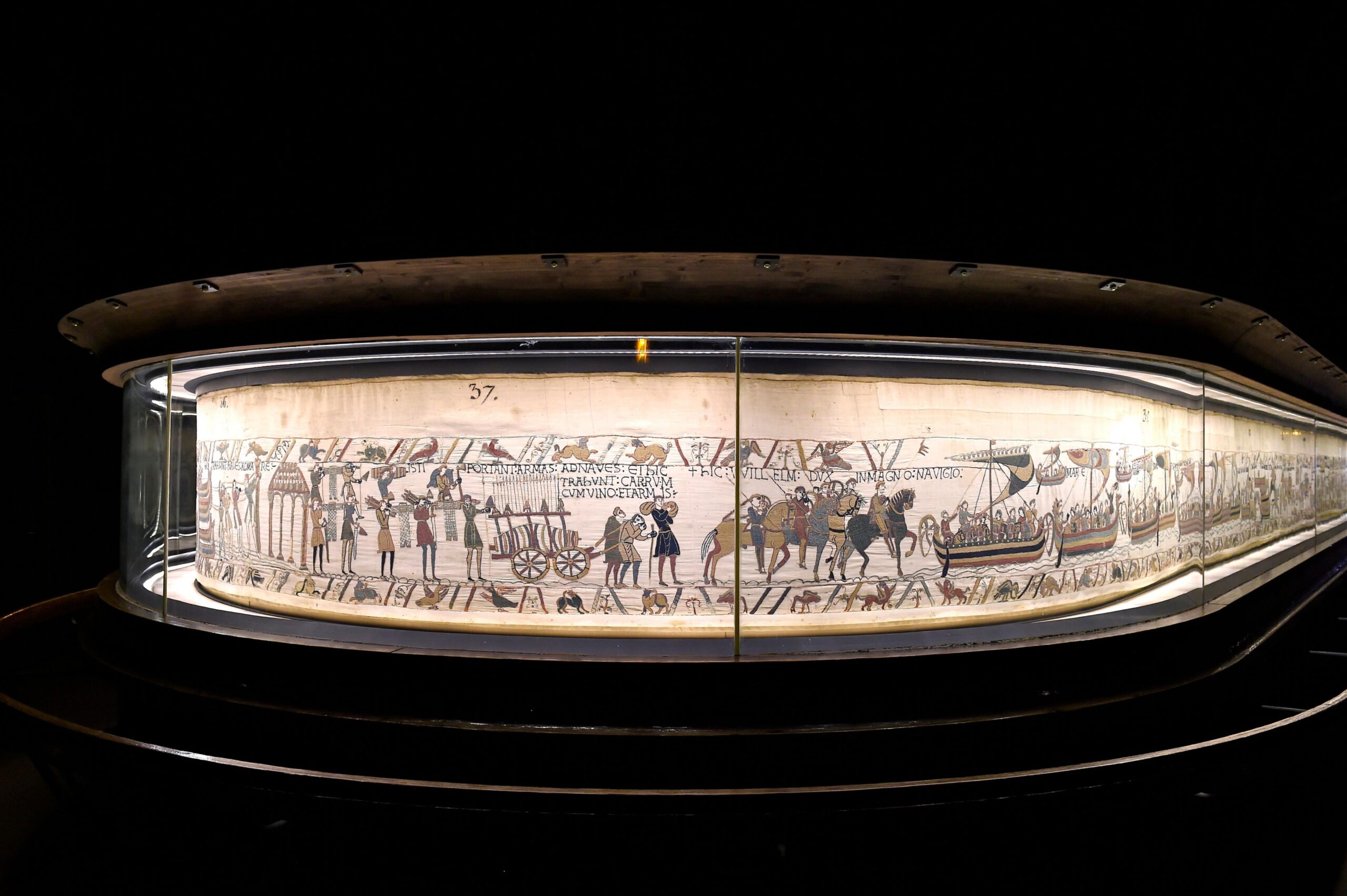 Bayeux Tapestry behind glass in Bayeux