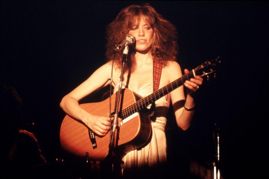 Carly Simon in the 1970s playing guitar