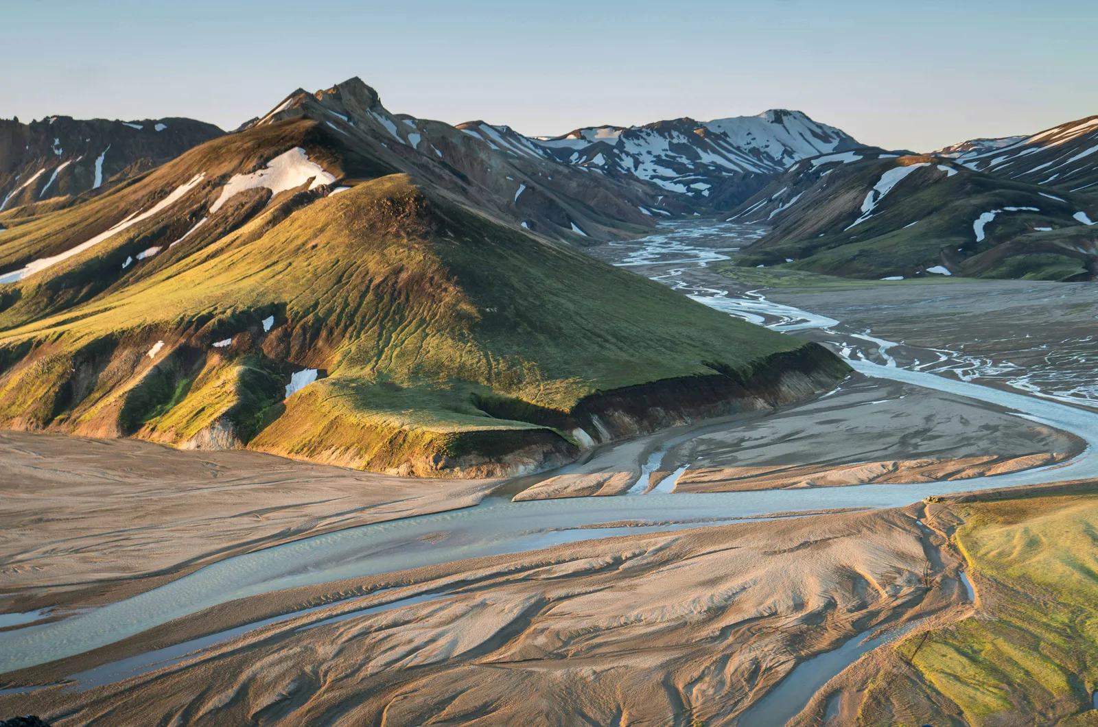 Image may contain Nature Outdoors Scenery Landscape Mountain Mountain Range Peak Slope Ice Wilderness and Road
