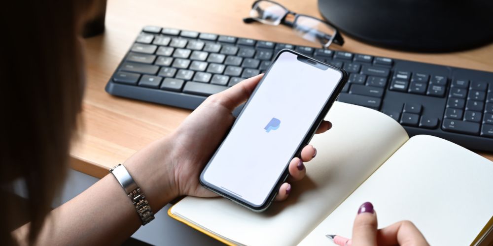 Woman using PayPal on a smartphone