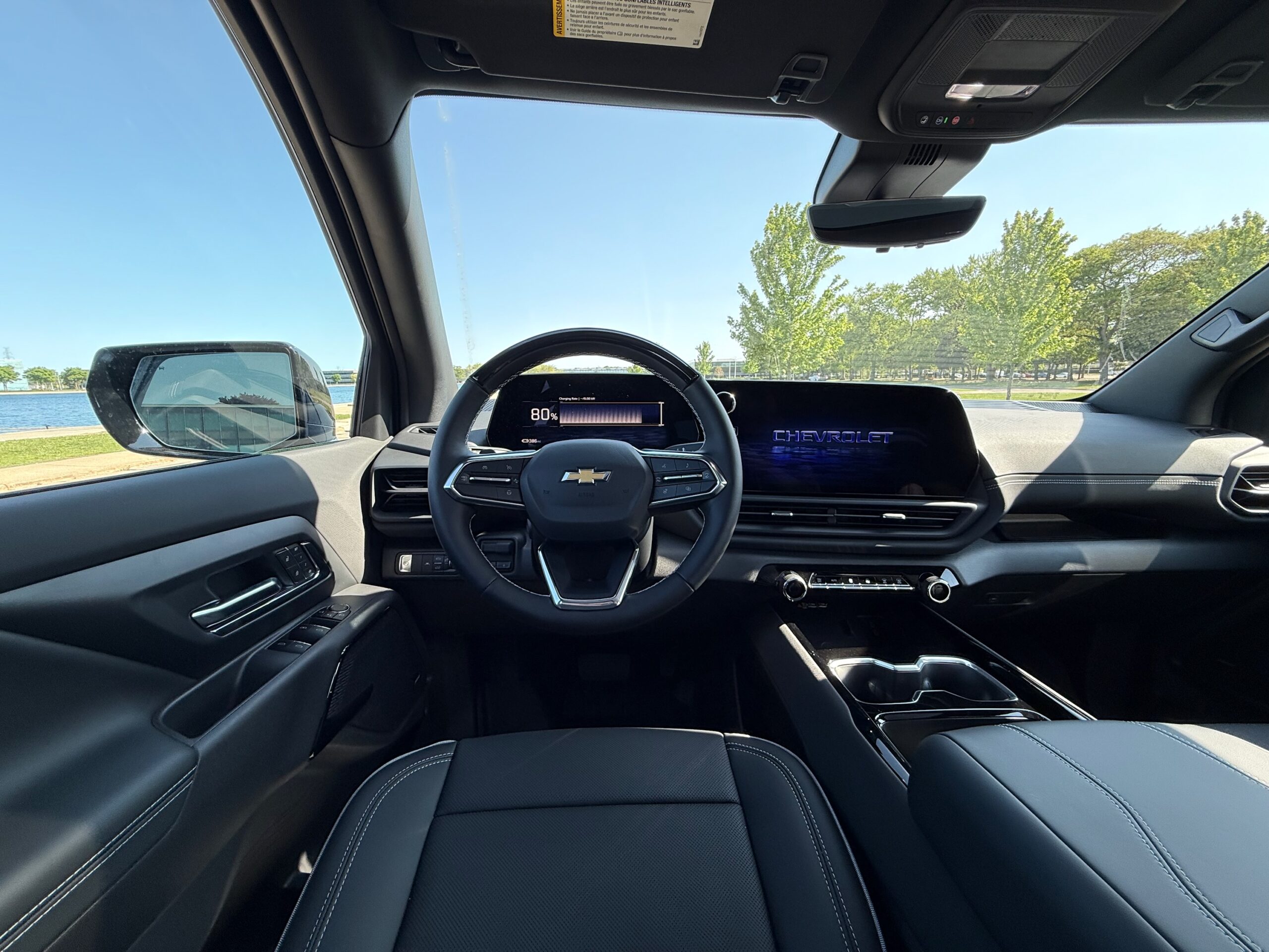 A screen shows 80% inside an electric pickup truck.