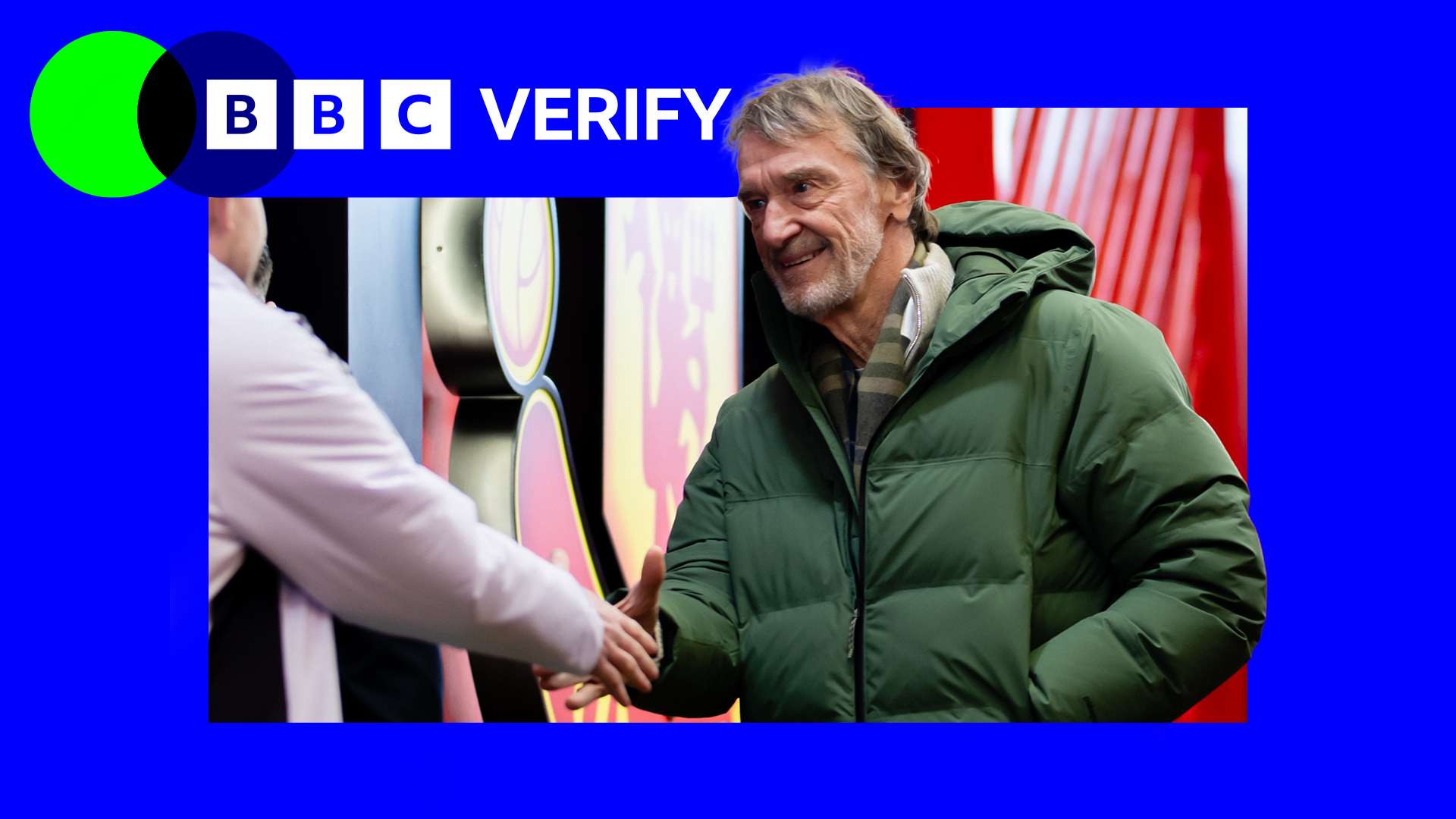 Sir Jim Ratcliffe wearing a green coat and shaking hands with someone
