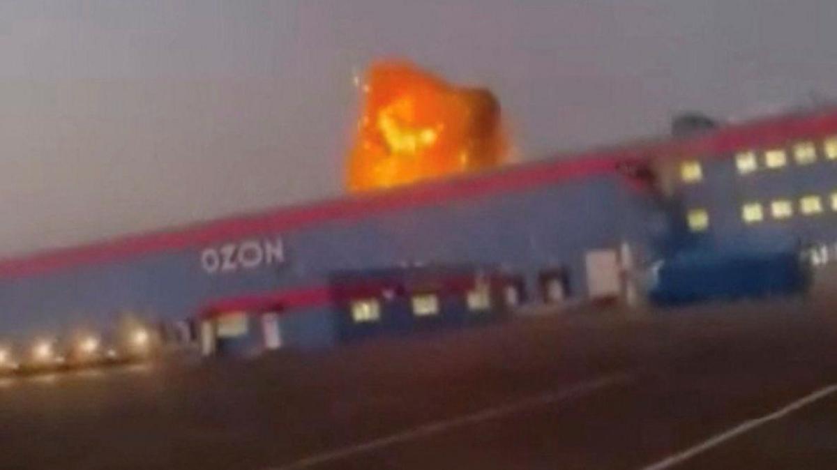 A screengrab from a video on social media showing flames rise from an Ozon facility following a Ukrainian drone strike in Makhachkala, Dagestan, Russia.