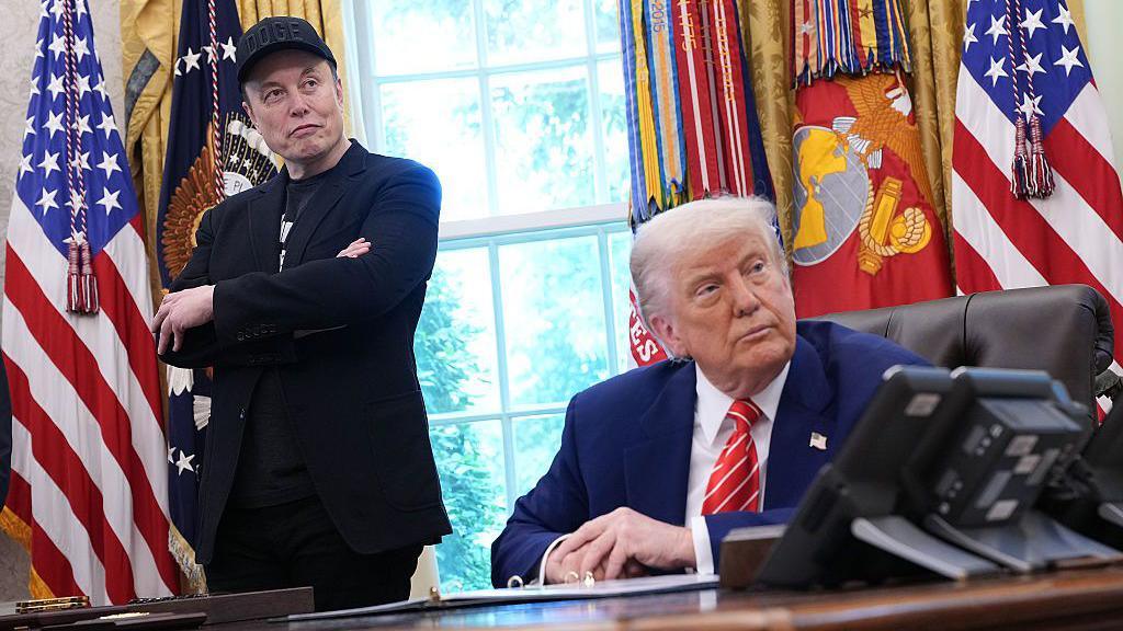 Tesla CEO Elon Musk and U.S. President Donald Trump listen to a question from reporters in the Oval Office of the White House on May 30, 2025 in Washington, DC