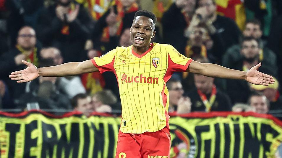 Mamadou Sangare pictured with his arms outstretched while playing for Lens