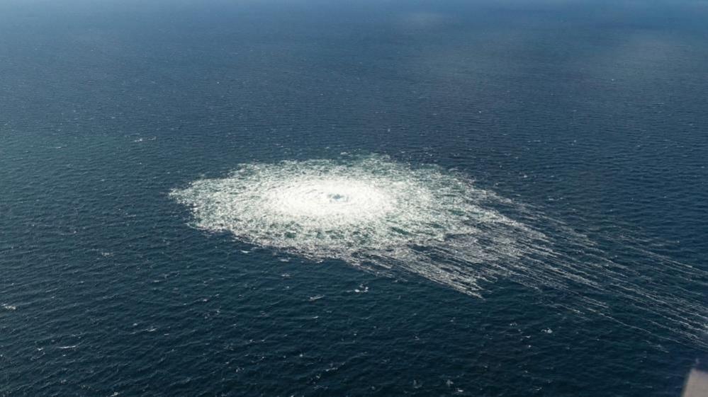 A gas leak in seen in blue waters