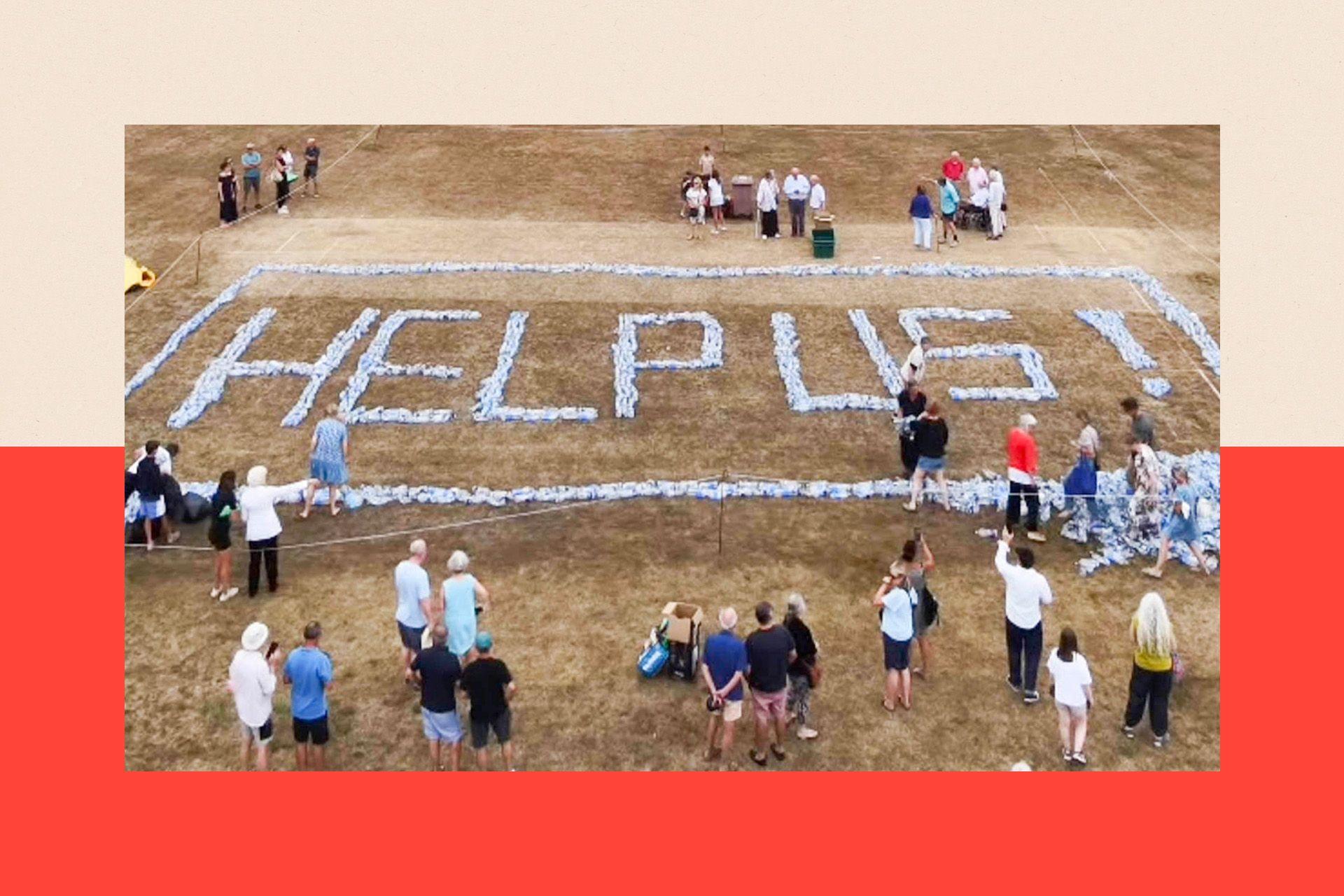 Plastic bottles are arranged to spell out the words 'HELP US'
