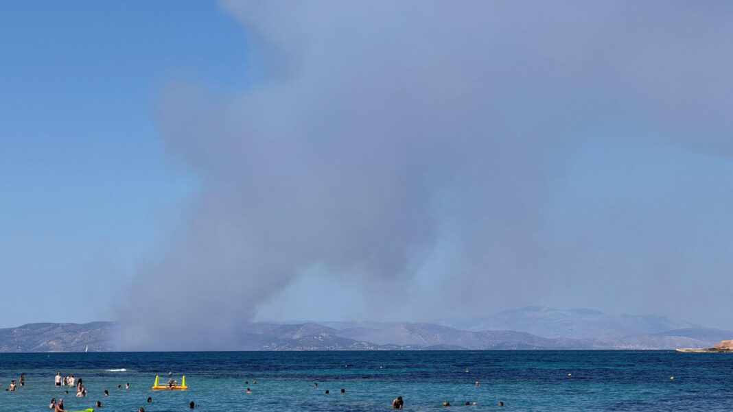Two dead and evacuation under way as fires break out on Greek island Two dead and evacuation under way as fires break out on Greek island