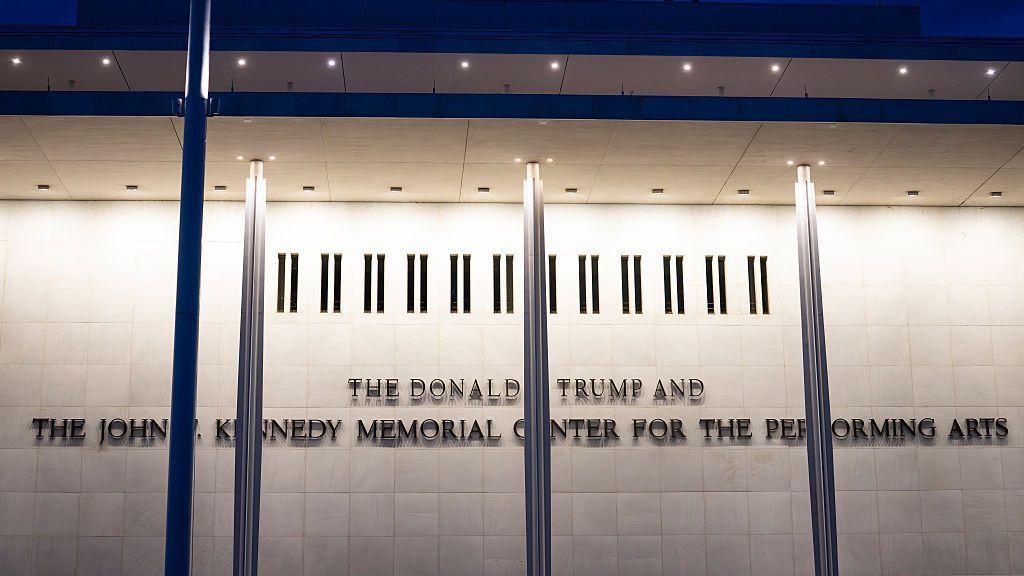 A close up of signage that says The Donald J Trump and John F Kennedy Memorial Center for the Performing Arts on 16 May 2026 in Washington DC.