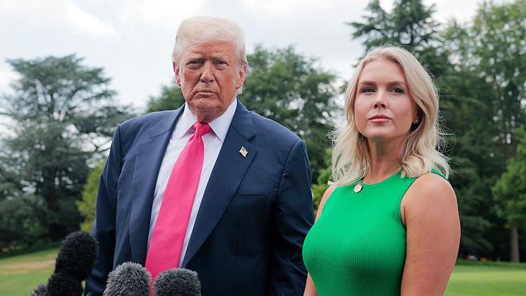 President Donald Trump, joined by White House Press Secretary Karoline Leavitt, speaks to the media as he departs the White House on July 15, 2025 in Washington, DC