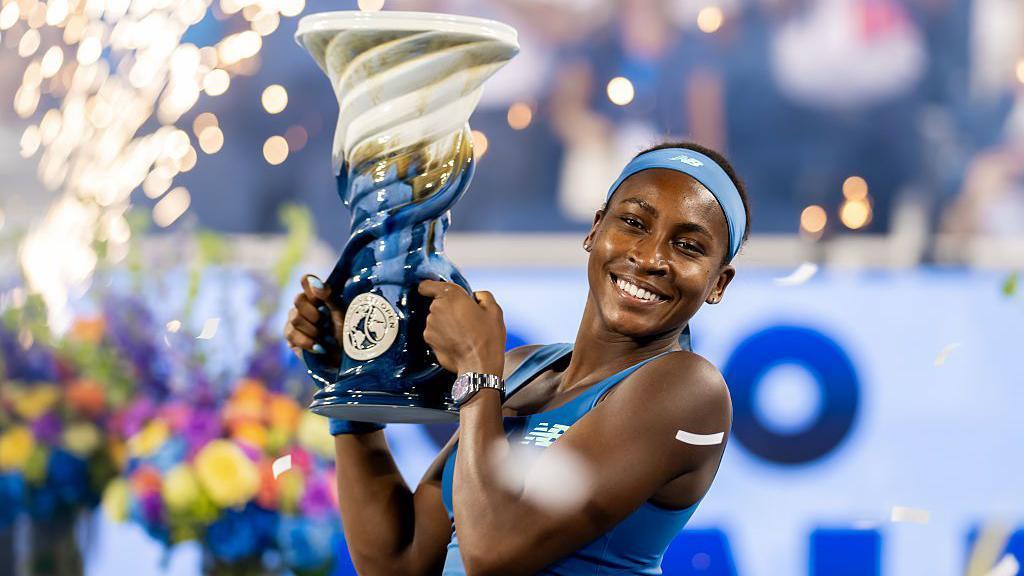 Coco Gauff of the United States poses with the Rookwood Cup after defeating Jessica Pegula of the United States in the women's singles final on the final day of the Cincinnati Open