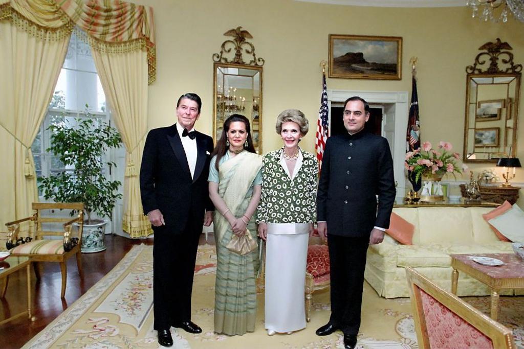 U.S. President Ronald Reagan and U.S. First Lady Nancy Reagan with Indian Prime Minister Rajiv Gandhi and his wife Sonia Gandhi in The Yellow Oval Room during a state dinner.