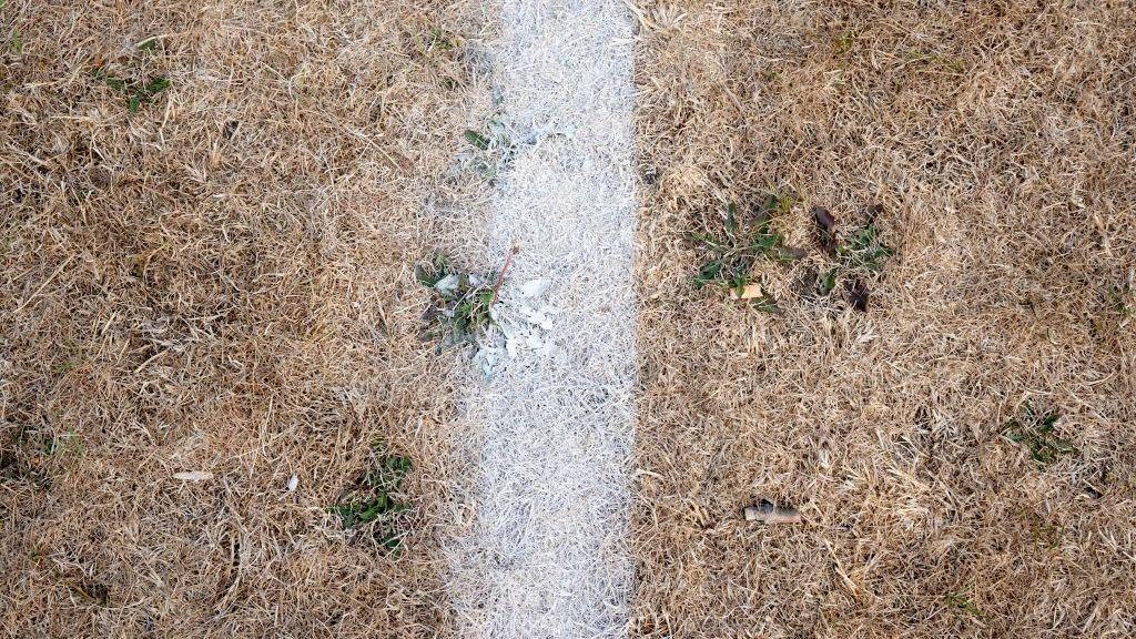 Dry pitch with white touchline