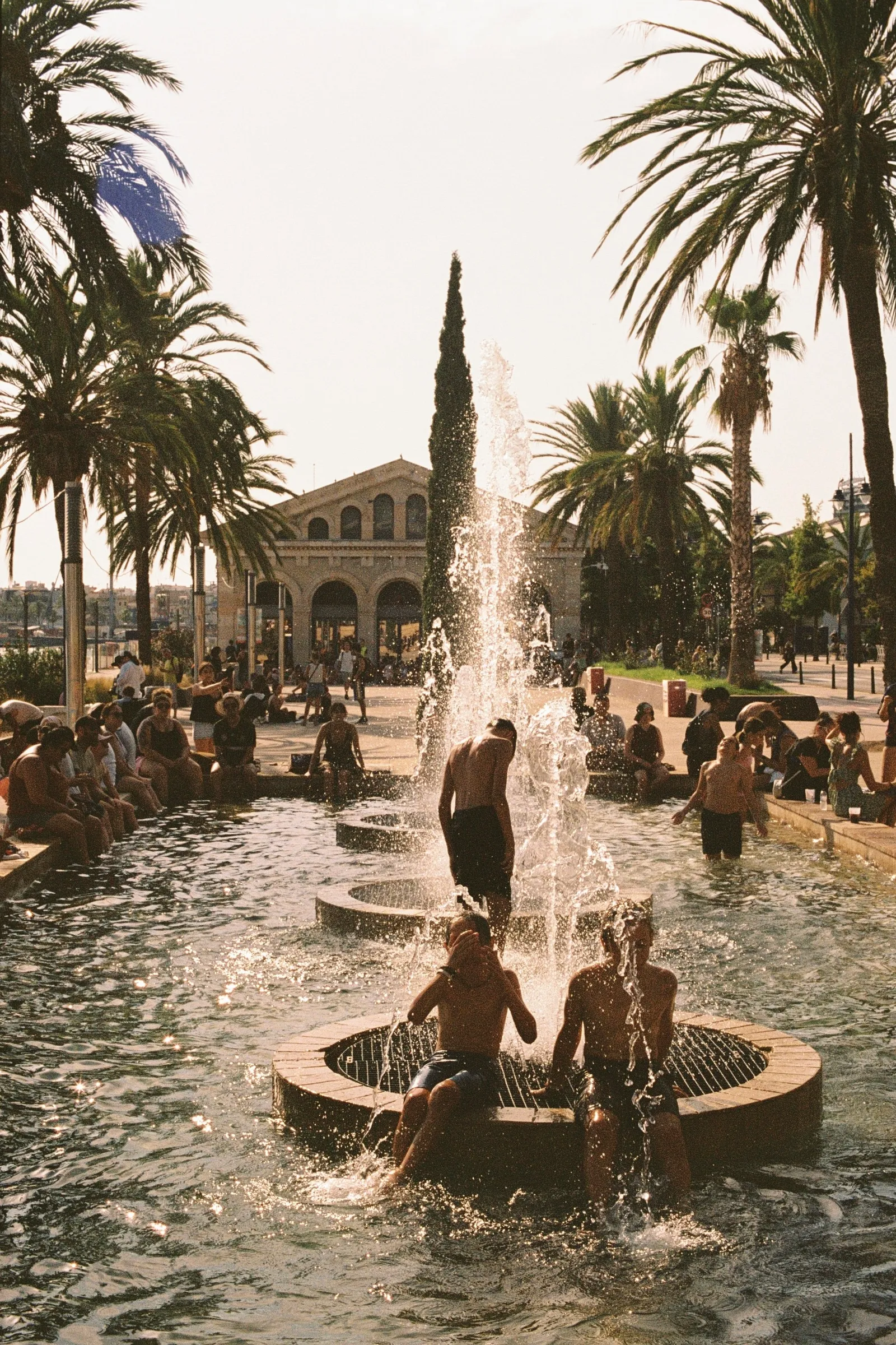 Image may contain Architecture Fountain Water Palm Tree Plant Tree Person Adult Building House Housing and Villa