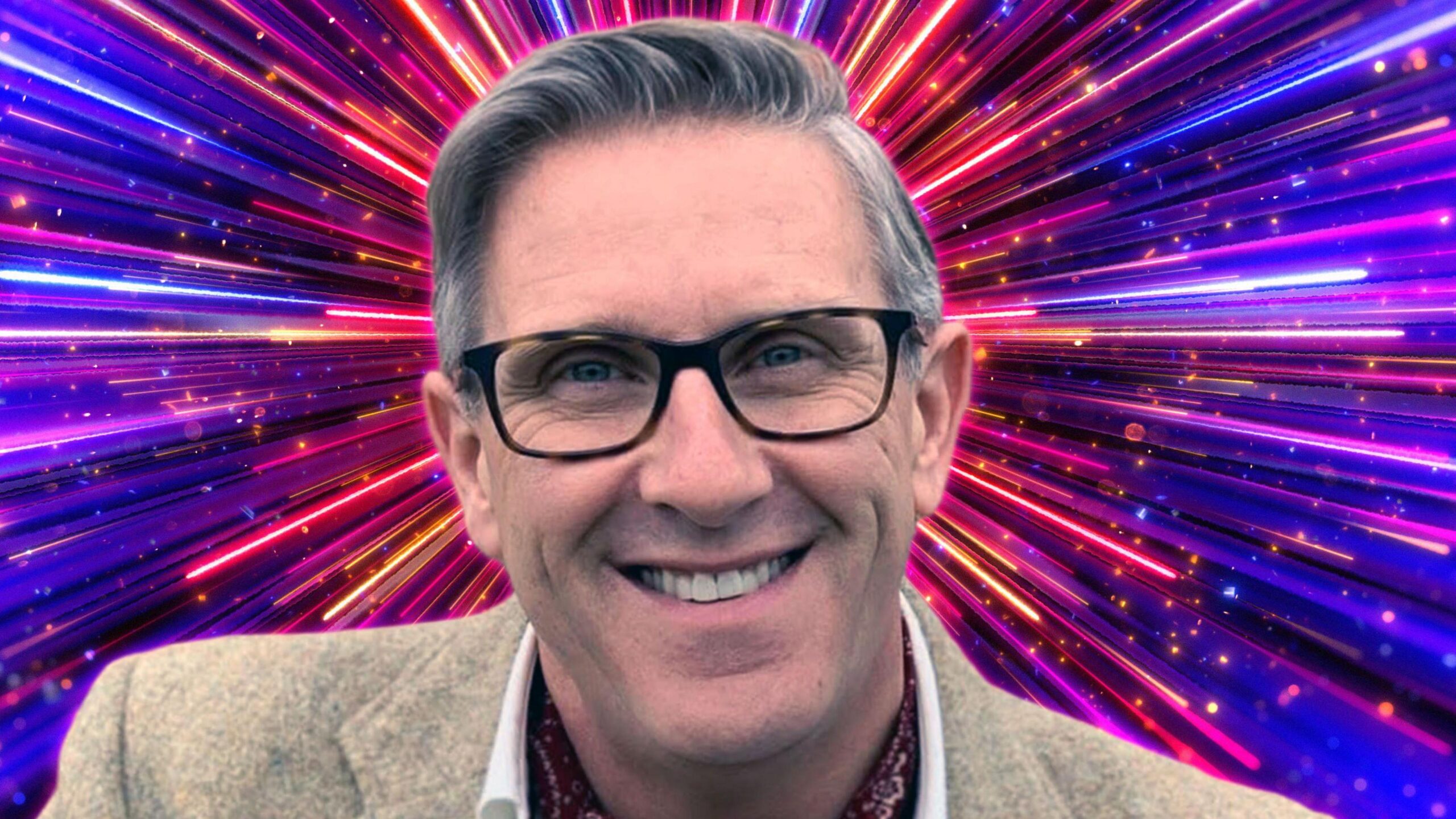 Graeme Hall pictured in front of the pink and purple Strictly Come Dancing background, smiling