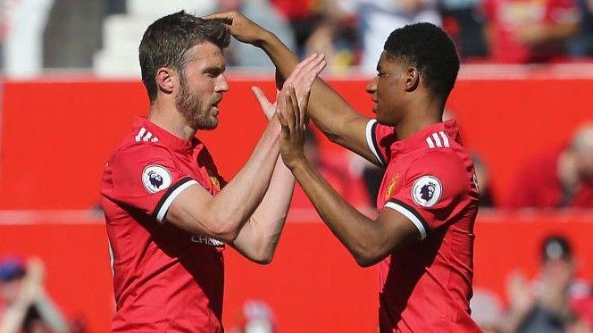 Marcus Rashford and Michael Carrick playing for Manchester United