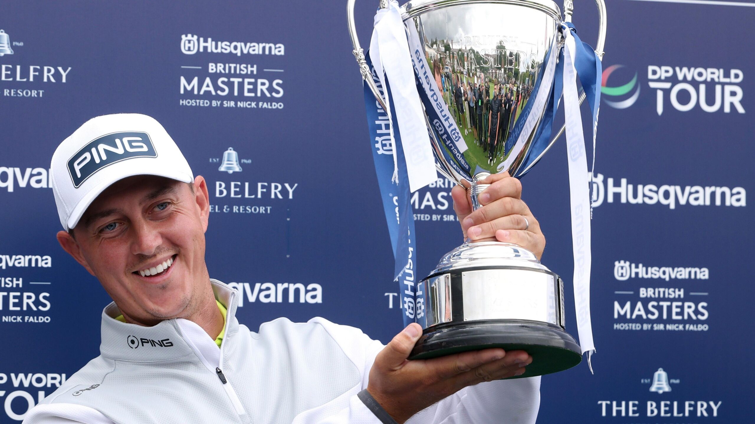 England's Joe Dean lifts the British Masters trophy