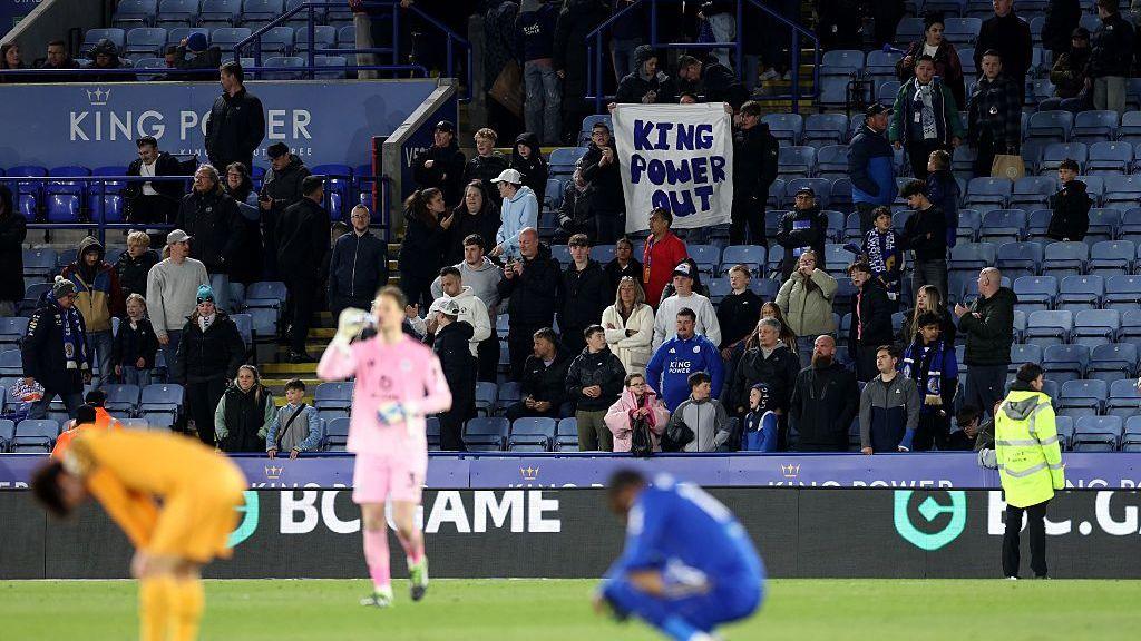 Leicester fans hold up a banner saying 'King Power out'
