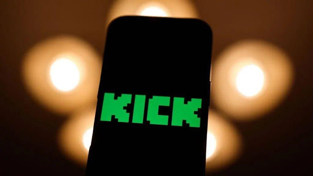 A phone screen shows the word "Kick", green and in a pixellated font.