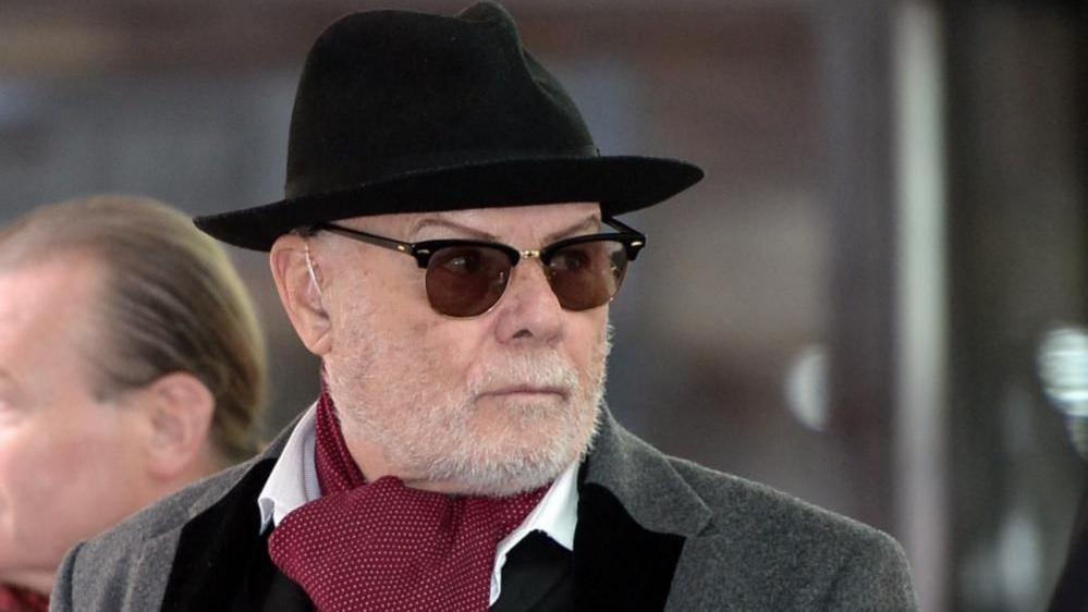 Gary Glitter pictured in 2015 wearing a trilby and sunglasses
