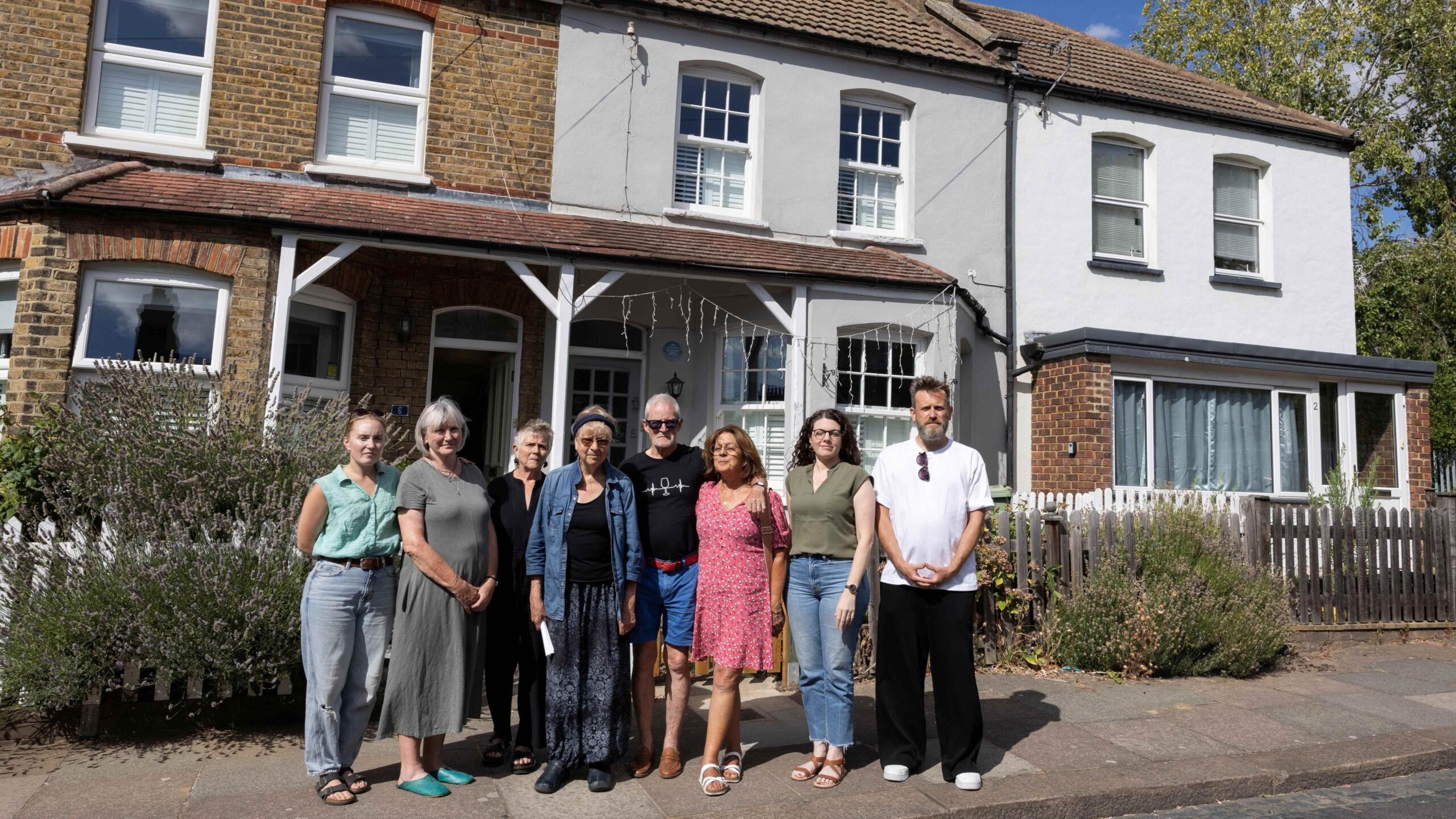 Picture of neighbours standing in front of the house