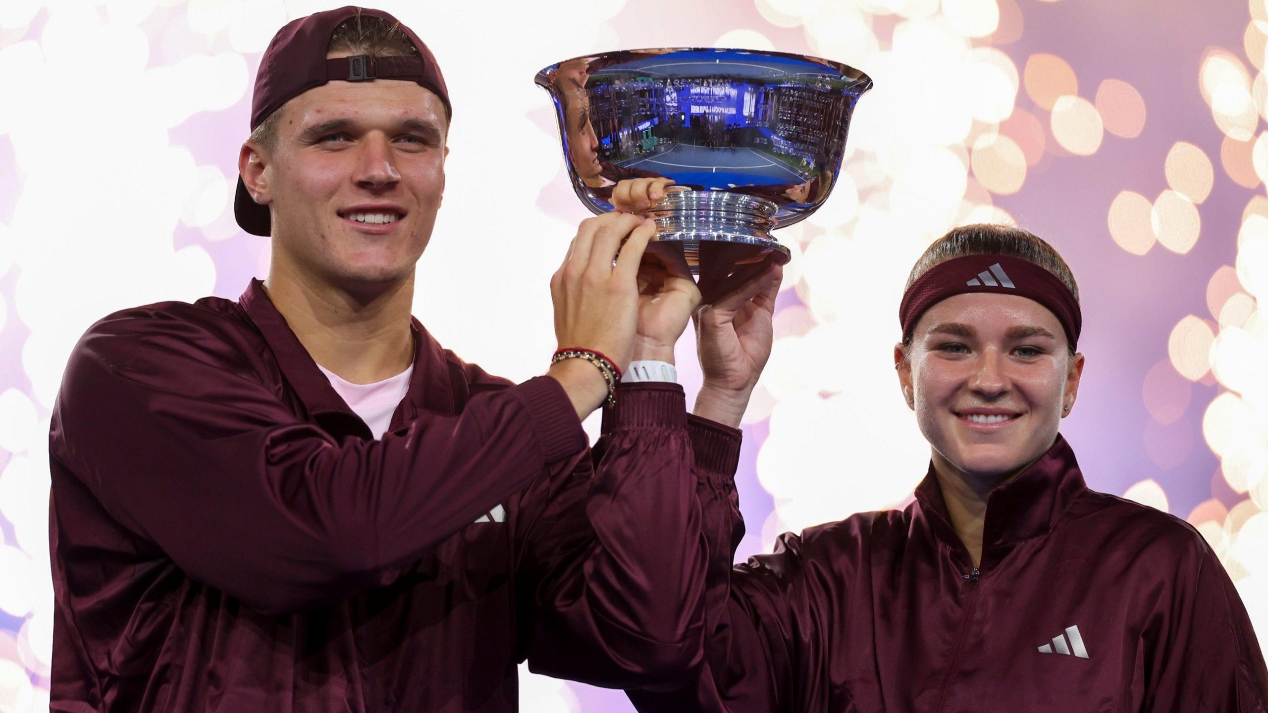Jakub Mensik and Karolina Muchova hold the US Open trophy