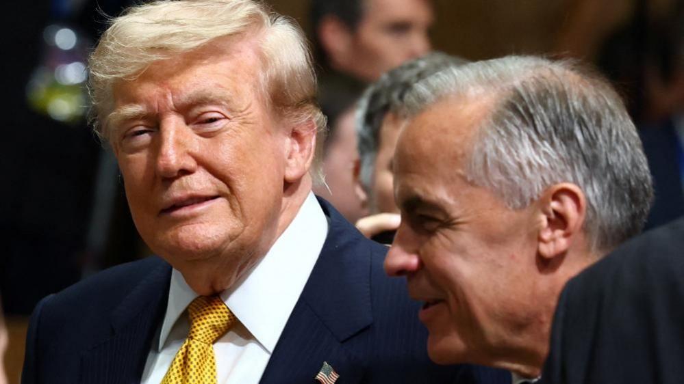 File image of US President Donald Trump and Canadian Prime Minister Mark Carney in conversation at an event