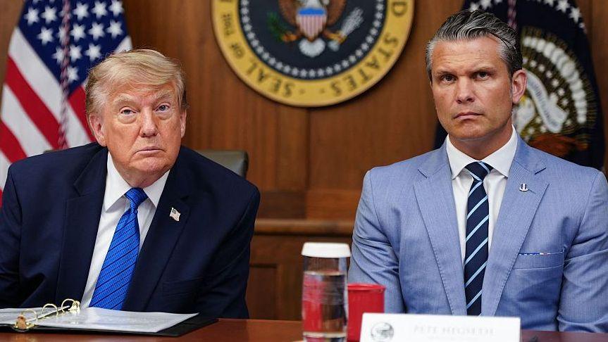 US President Donald Trump and Secretary of Defense Pete Hegseth listen to questions from the press during a Cabinet meeting.