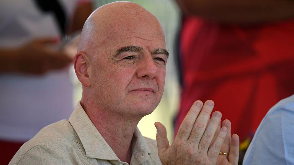 Gianni Infantino applauds during a ceremony in Colombia