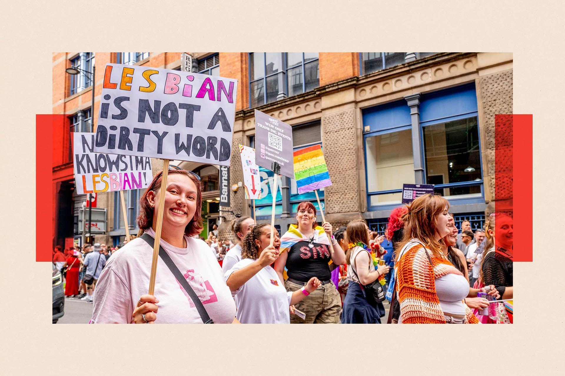 A photo of a woman holding a placard at Manchester Pride, saying "lesbian is not a dirty word"