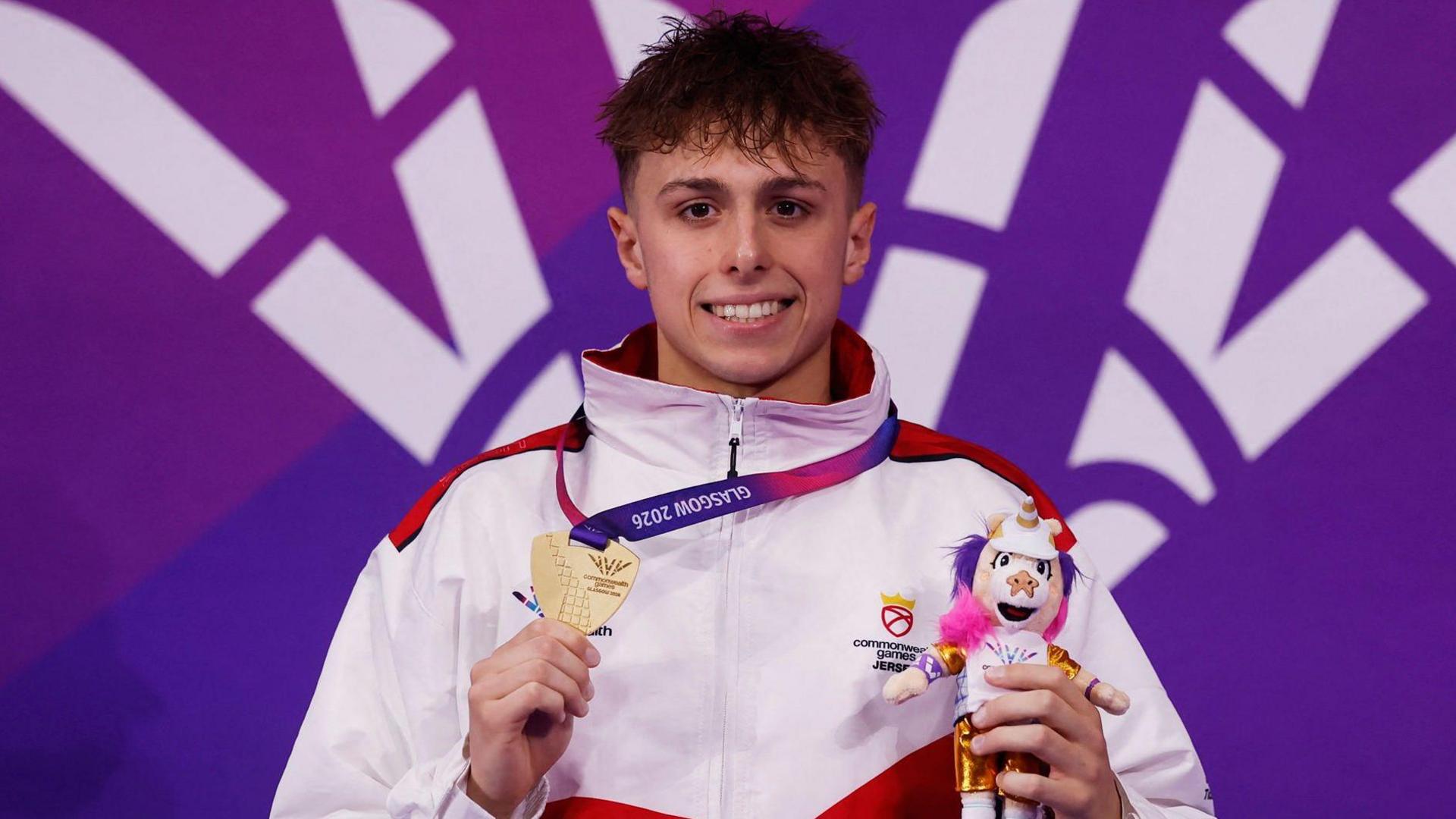 Filip Nowacki holds his gold medal