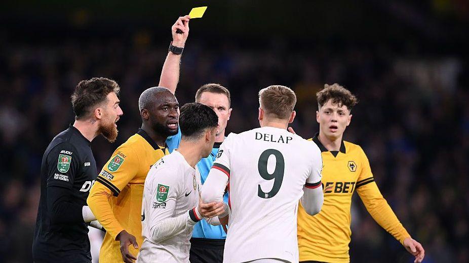 Chelsea forward Liam Delap is booked during the Carabao Cup game against Wolves in December