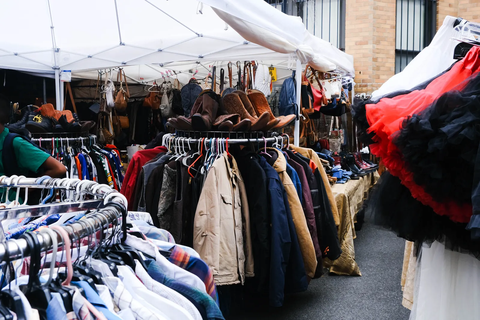 Image may contain Accessories Bag Handbag Clothing Coat and Market