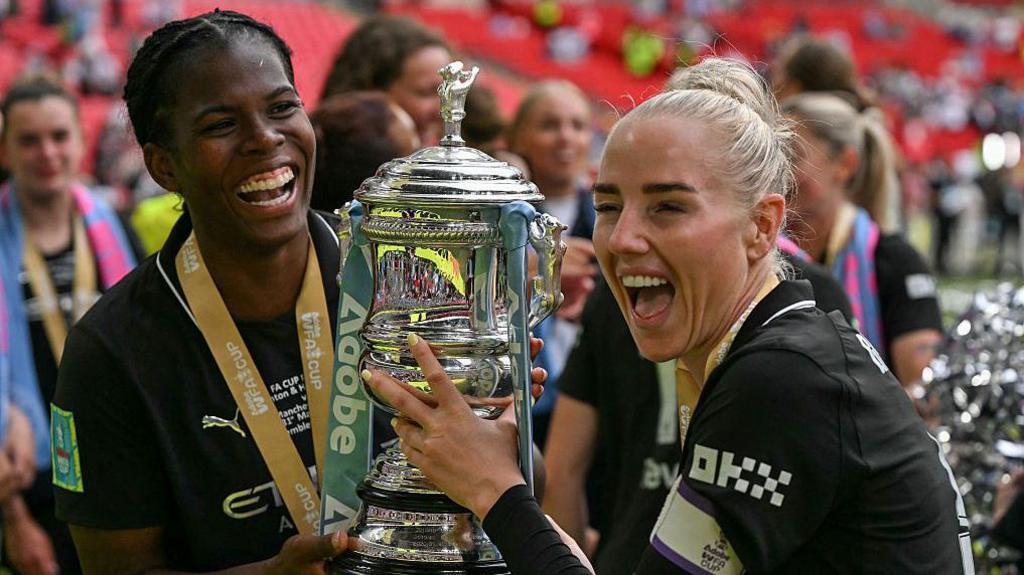 Alex Greenwood and Bunny Shaw celebrating winning the Women's FA Cup last season