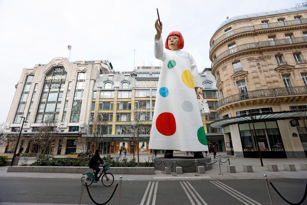 A huge sculpture in the likeness of Yayoi Kusama is erected between the headquarters of the Maison Louis Vuitton and the Samaritaine department store on March 06, 2023 in Paris, France.