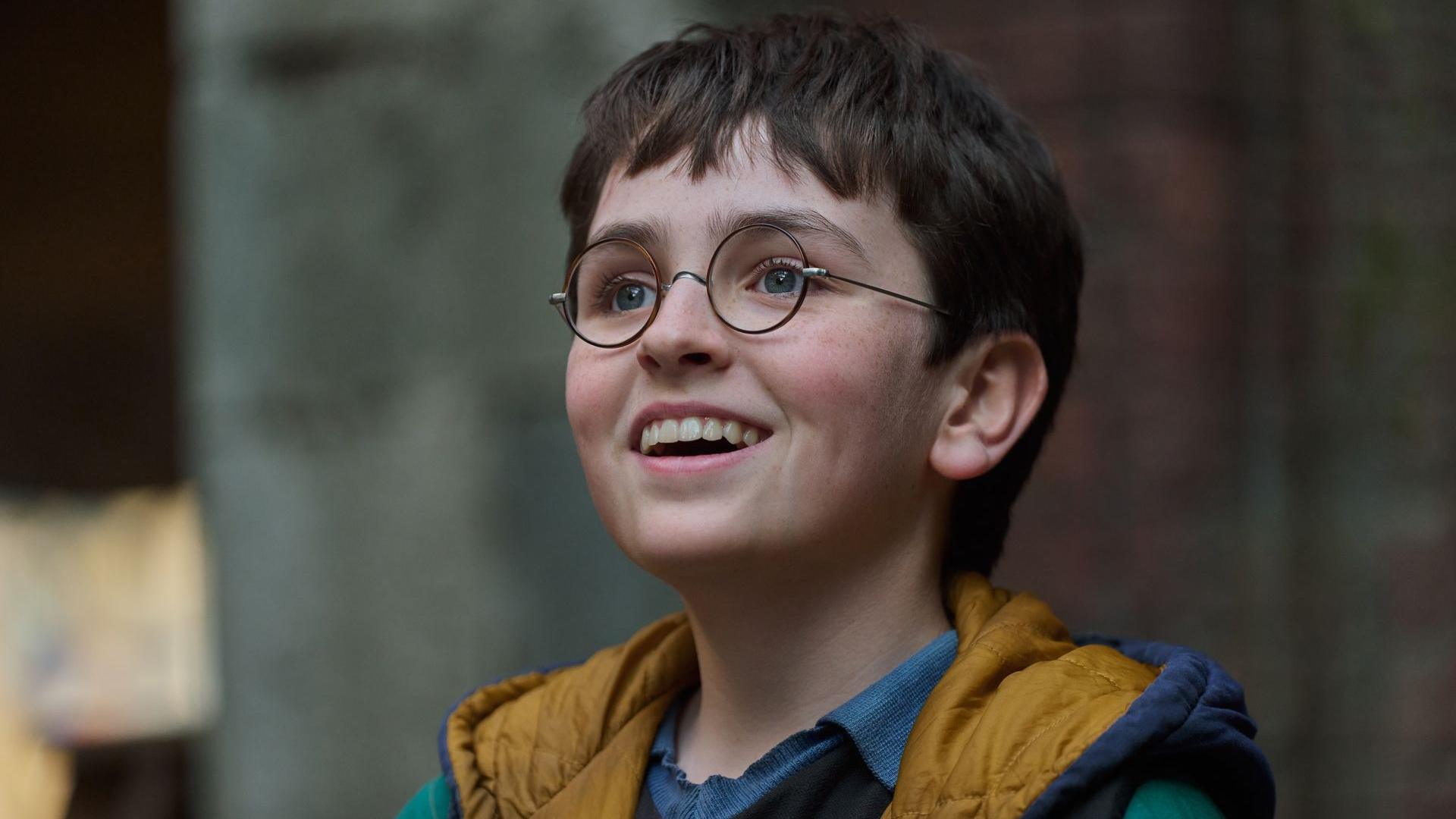 Dominic McLaughlin in round glasses in a scene from Harry Potter