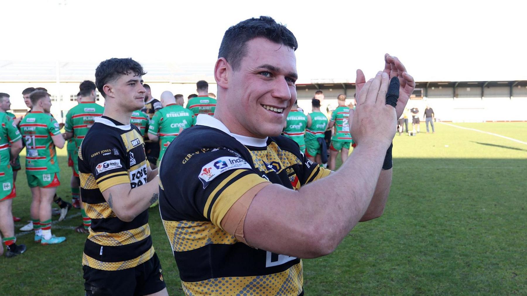 Kyle Tayler-Woolston applauds the Newport fans after victory against Ebbw Vale