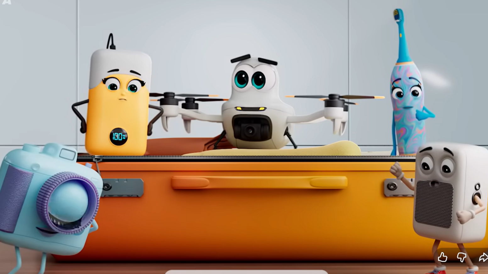 Cartoon electronic devices, including a drone and a toothbrush, sit on a suitcase as part of an IATA safety campaign.