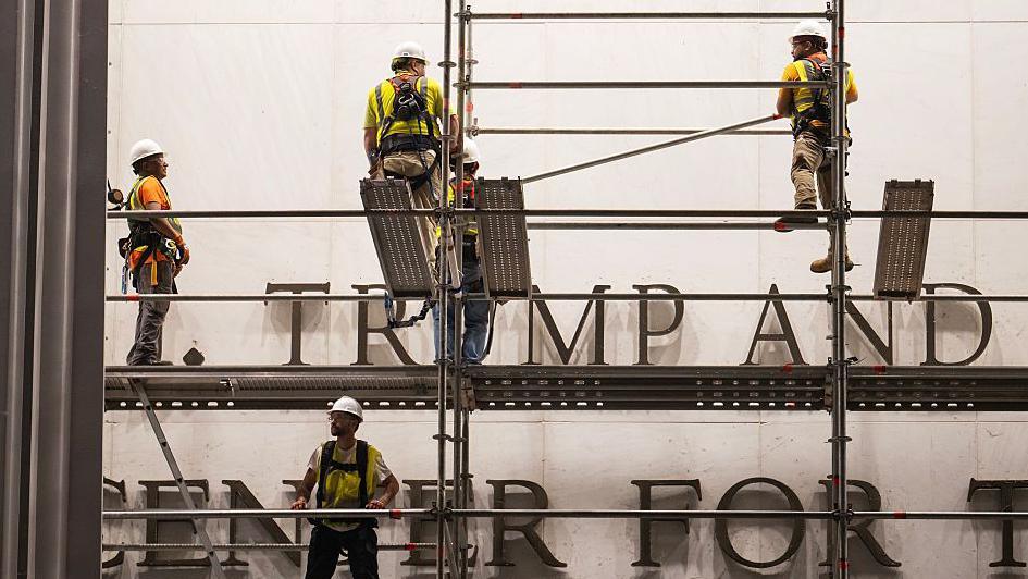 Workers put up scaffolding prior to the removal of President Donald Trump's name from the Kennedy Center on June 12, 2026 in Washington, DC.
