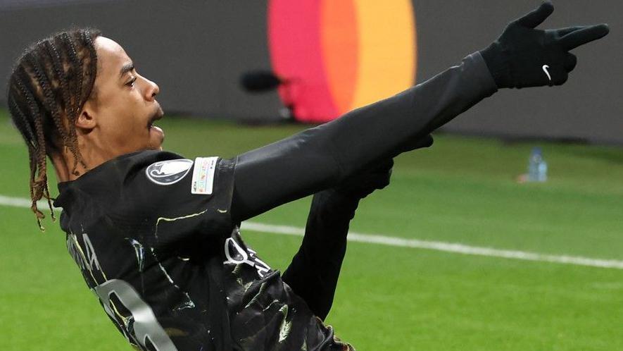 Paris Saint-Germain's Bradley Barcola celebrates after opening the scoring during the Champions League round of 16 first leg football match against Chelsea at the Parc des Princes in Paris in March 2026.