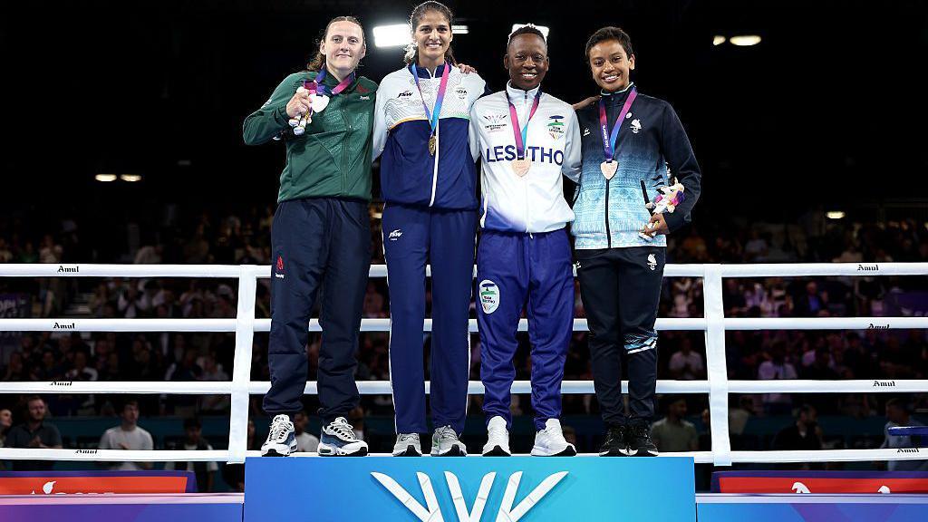 Michaela Walsh on podium with other medal winners