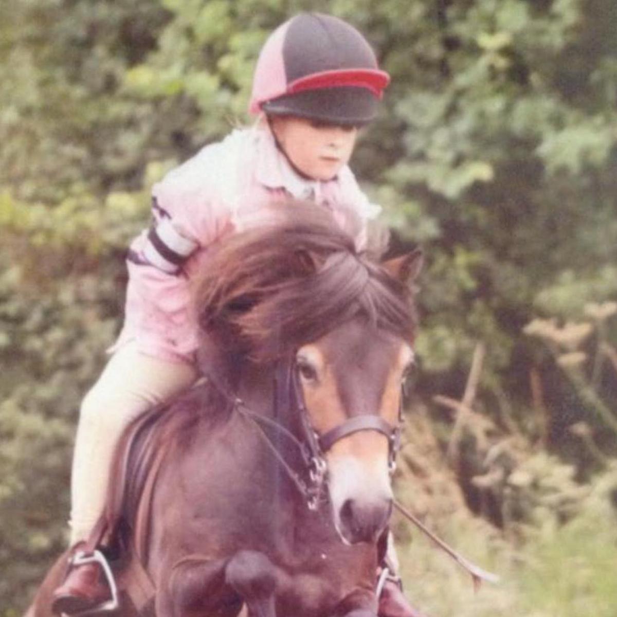 Saffron Cresswell riding a horse as a child