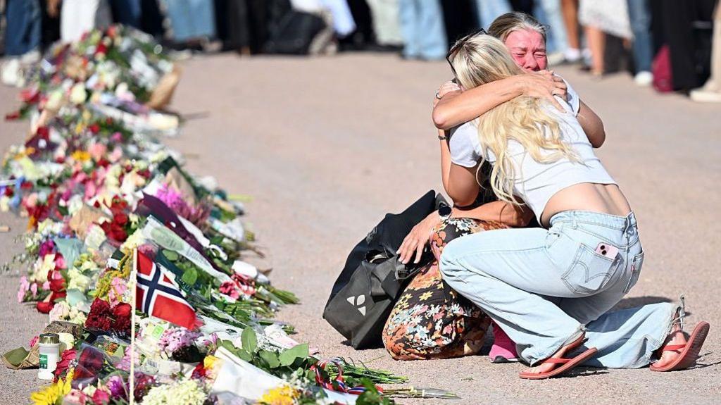 People are gathering at The Palace Square to pay their respect to King Harald V of Norway who is at Oslo University Hospital in a serious condition on August 27, 2026 in Oslo, Norway